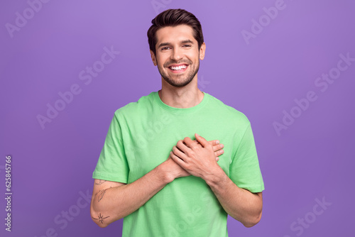 Bilde på lerret Photo of young smile guy hands touch chest heart thankful grateful appreciate yo