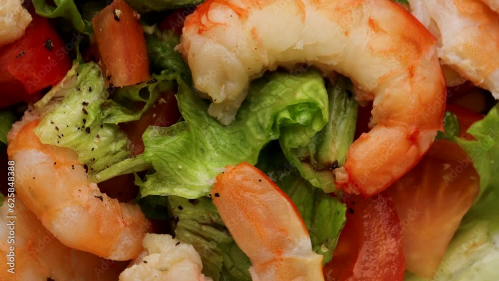 Salad with vegetables and shrimps , rotation in circle. shrimp salad, Turning. selective focus. close-up Salad with vegetables and shrimps , rotation in circle. shrimp salad, Turning. selective focus. close-up