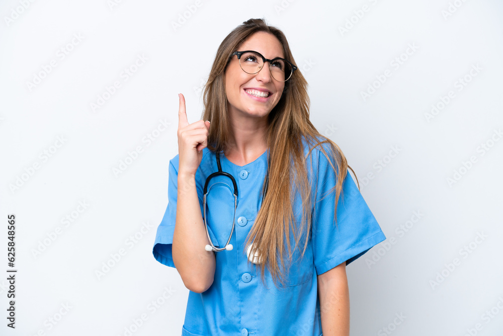 Young surgeon doctor woman isolated on blue background pointing up and surprised Young surgeon doctor woman isolated on blue background pointing up and surprised