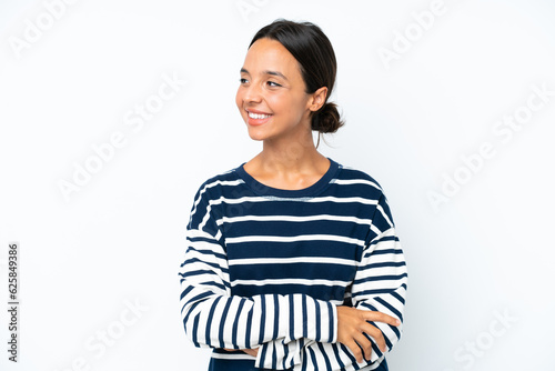 Young hispanic woman isolated on white background looking to the side and smiling