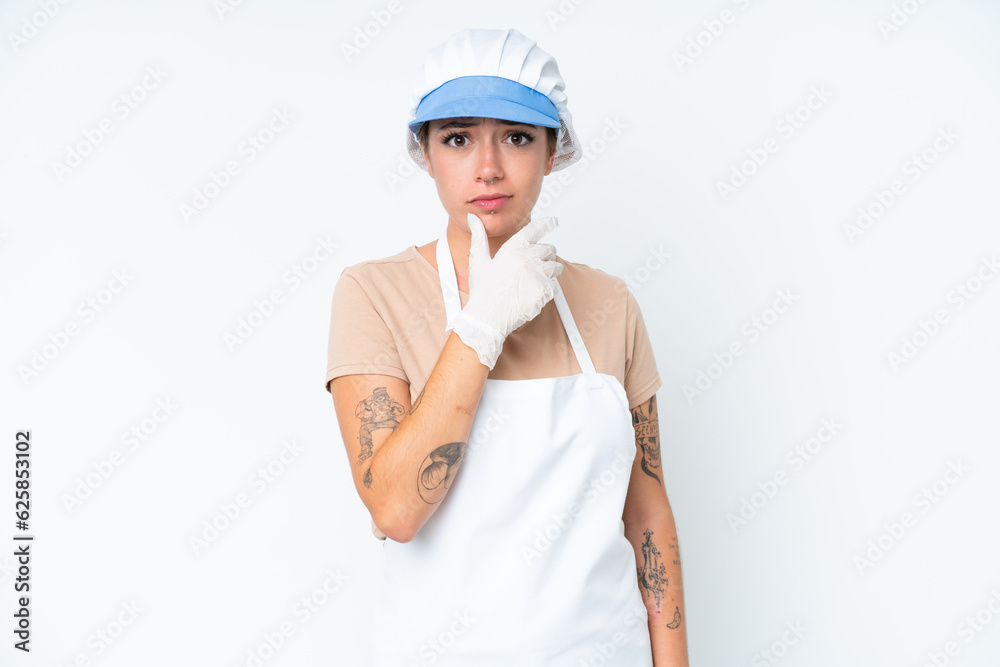 Fishmonger wearing an apron and holding a raw fish isolated on white background thinking Fishmonger wearing an apron and holding a raw fish isolated on white background thinking