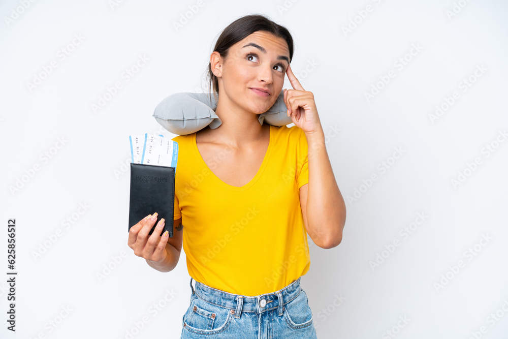 Woman with Inflatable Travel Pillow over isolated background having doubts and thinking Woman with Inflatable Travel Pillow over isolated background having doubts and thinking