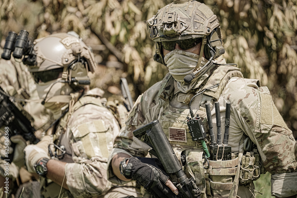 United States Army ranger during the military operation. Professional marine soldiers training with weapon on a military range.