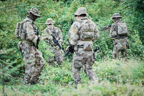 United States Army ranger during the military operation. Professional marine soldiers training with weapon on a military range.