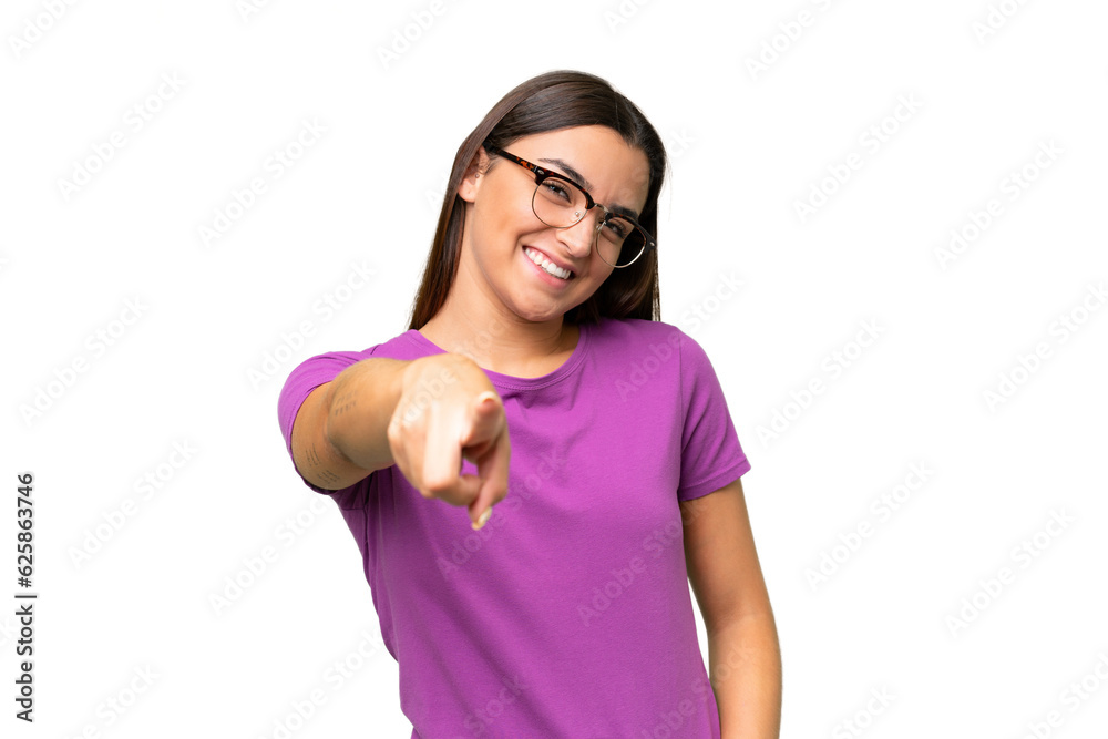 Young caucasian woman isolated on green chroma background pointing front with happy expression Young caucasian woman isolated on green chroma background pointing front with happy expression