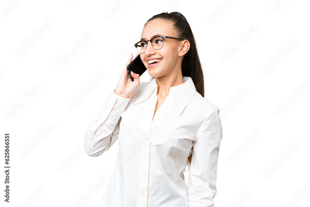 Young Arabian woman over isolated chroma key background keeping a conversation with the mobile phone Young Arabian woman over isolated chroma key background keeping a conversation with the mobile phone
