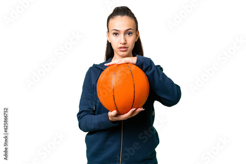 Young Arabian woman over isolated chroma key background playing basketball