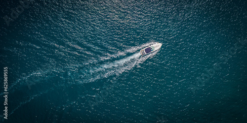 Topdown aerial shot of a motorboat on the Adriatic sea.