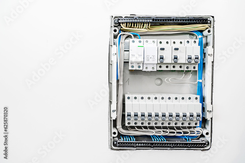 Electrical distribution box. Wires and fuses on the instrument panel of electrical equipment. Construction and repair in an apartment or house. Close up