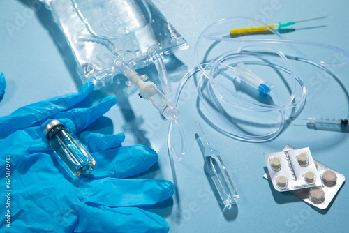 Wallpaper Mural  Infusion bag, syringe, medical ampoules in the blue background. IV drip chamber Torontodigital.ca