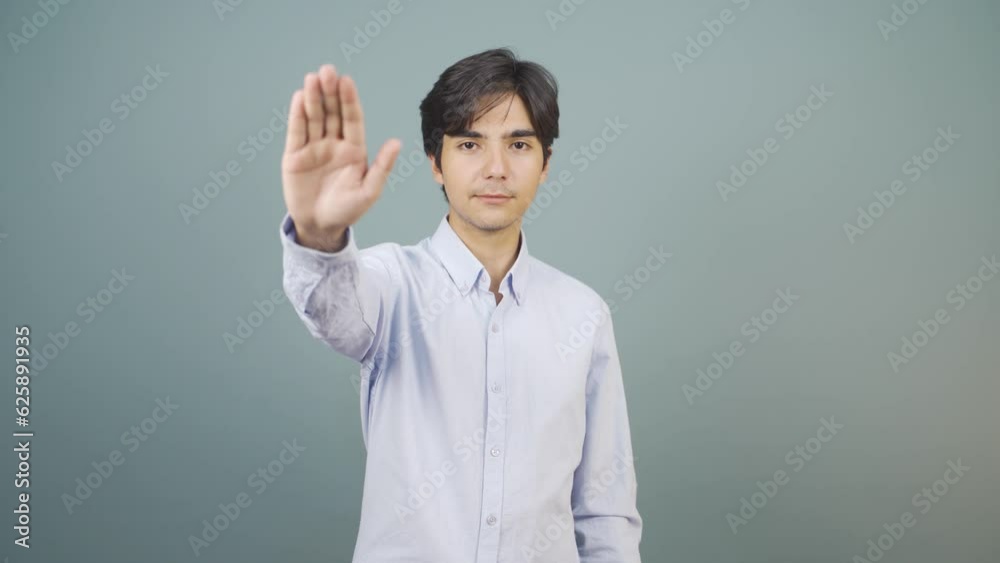Man making stop sign for camera. Man making stop sign for camera.