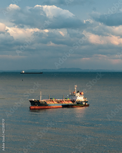 Cargo ship in the sea at golden hour