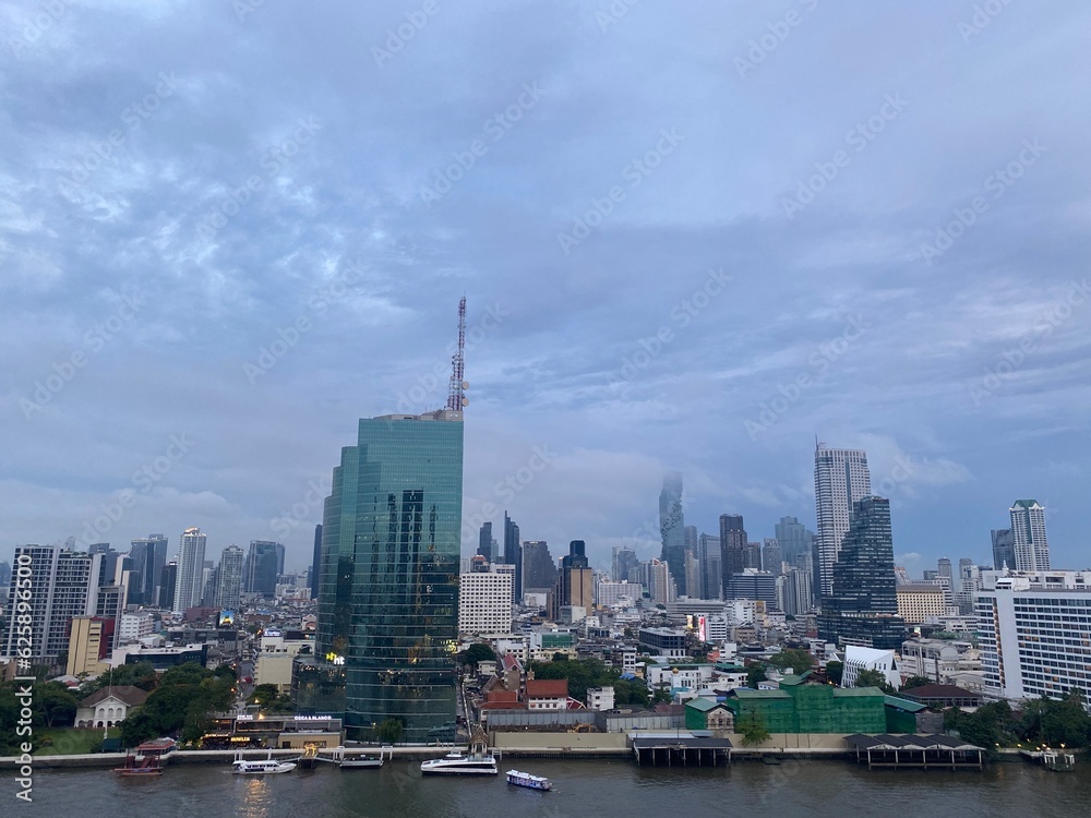 View from ICONSIAM shopping mall Saw many famous high-rise buildings in the center of Bangkok on a rainy evening in Thailand.

This is the original image from the iPhone 11.