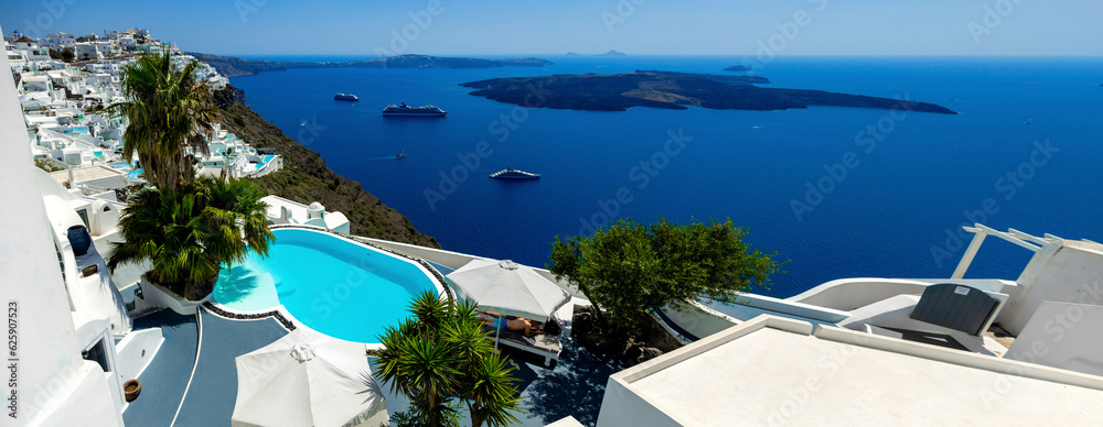 Fototapeta premium Santorini, Greece. Amazing view of blue sky, sea and pool from luxury resort in Santorini greek island.