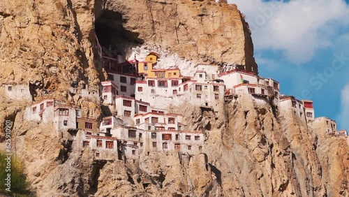 View of the Phugtal monastery built inside the mountain cave during the sunset near Purne in Zanskar Valley, Ladakh, India. Monastery built inside mountains in Zanskar. Remote monastery in India.