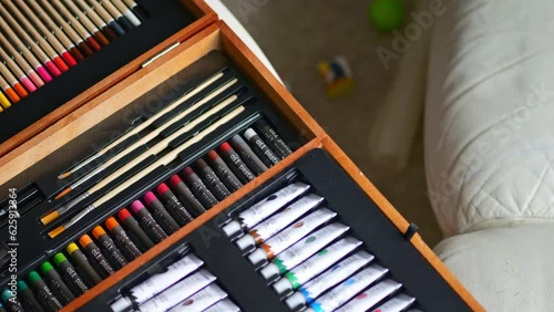 Wallpaper Mural A professional drawing and painting set in a wooden case rotates in front of the camera. Torontodigital.ca