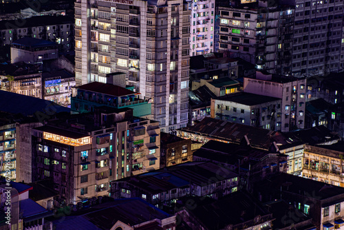 High angle view of illuminated buildings in city at night in Yangon downtown, Myanmar, Asia 