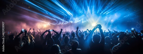  A crowd of people at a live event, concert or party holding hands and smartphones up . Large audience, crowd, or participants of a live event venue with bright lights above. Generative AI