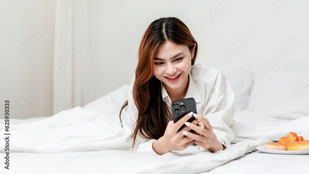 Activity at home leisure lifestyle concept, Young woman in clothes casual using smartphone to surfing Activity at home leisure lifestyle concept, Young woman in clothes casual using smartphone to surfing