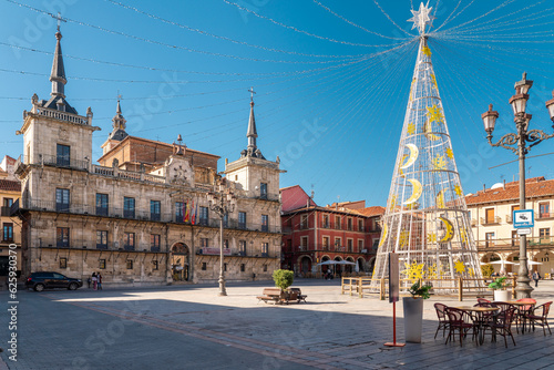 Leon, Spain - November 12 2022: Christmas tree in the city center of Leon in Plaza Mayor Square. Streets of Leon decorated with lights and ornaments in anticipation of the Christmas celebration. 