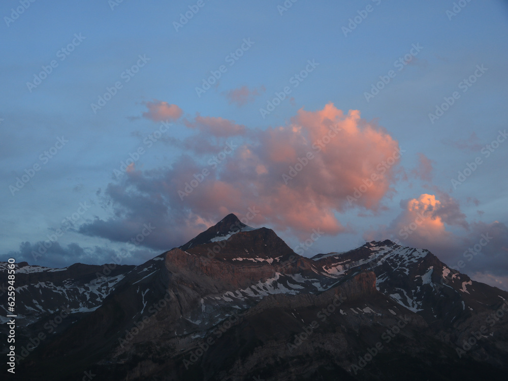 Bright lit evening cloud over the Les Diabletets range.