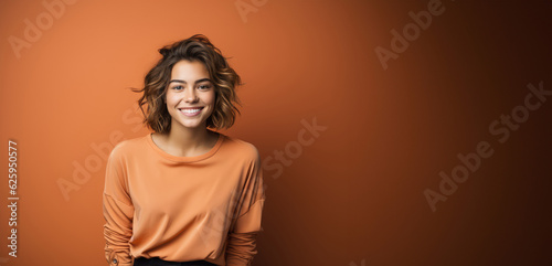 Smiling Woman Against a Solid Color Background photo