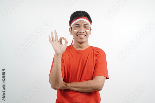 Man celebrating Indonesia independence day with okay gesture