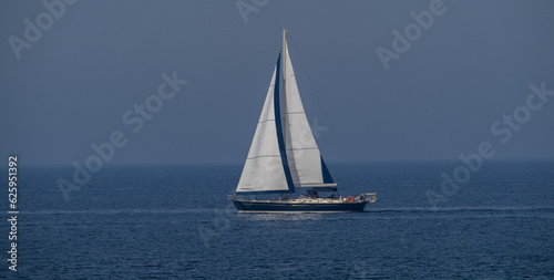 A sailboat anchored in calasetta, south Sardinia, Italy.