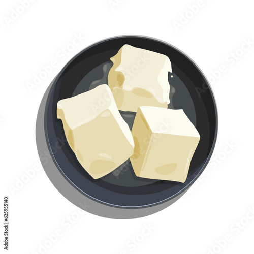 A plate with butter, cut into cubes, which began to gently melt.