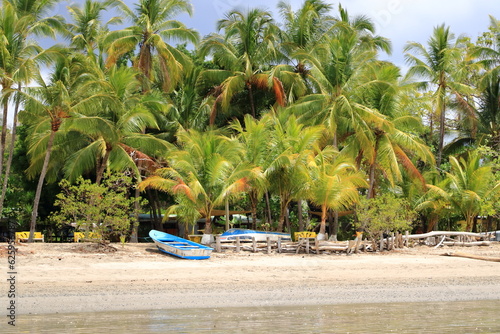 Outdoor view of colorful boats on the tropical beach of Samara in Costa Rica