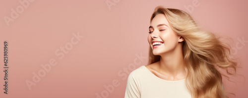 Fotografia Smiling young woman with blonde long groomed hair isolated on pastel flat background with copy space