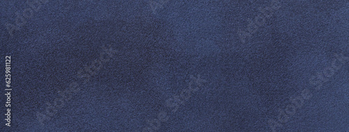 Texture of velvet matte navy blue background, macro. Suede denim fabric with pattern. Seamless textile felt backdrop