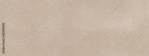 Texture of velvet matte beige background, macro. Suede light brown fabric with pattern. Seamless textile felt backdrop,