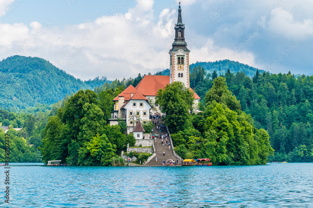 A close up view from the southern shore across Lake Bled towards the island in Bled, Slovenia in summertime