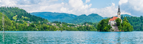 A panorama view from the southern shore across Lake Bled towards the island in Bled, Slovenia in summertime