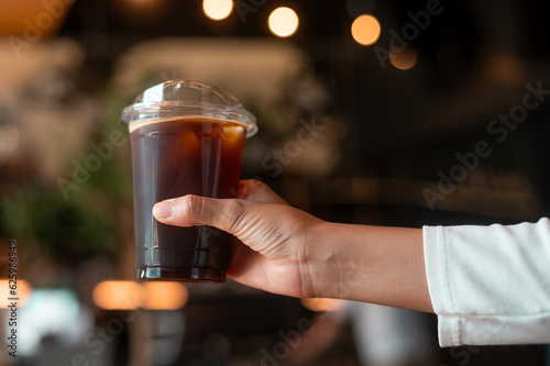 A glass of Black coffee in modern coffee shop