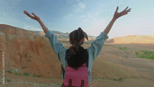 Wallpaper Mural Hiker woman standing with hands up achieving the top. Girl welcomes a sun. Successful woman hiker open arms on sunrise mountain top. Freedom, sport, success and mental health concept Torontodigital.ca