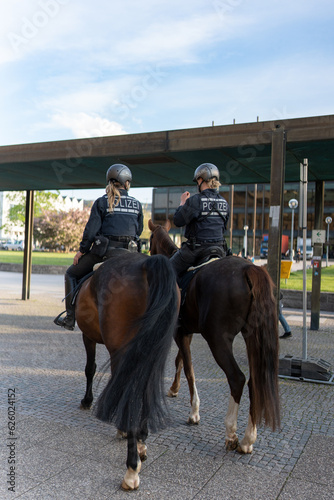 Police patrol on horseback. The Baden-Würtenberg Mounted Police. Policemen on horseback patrol the city. Law enforcement agencies.