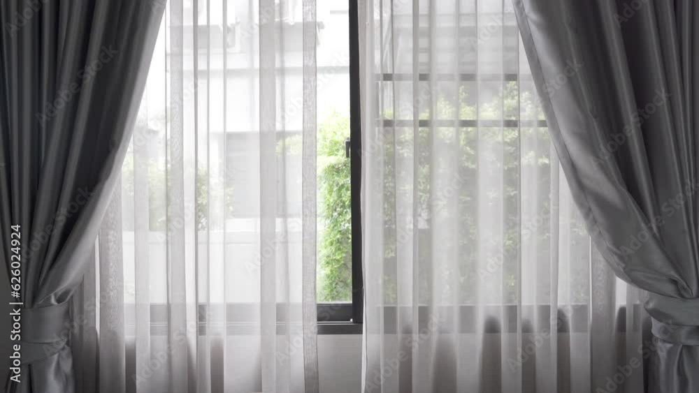 Beautiful curtains on window blured green tree in backyard garden, stylish room interior design. Beautiful curtains on window blured green tree in backyard garden, stylish room interior design.