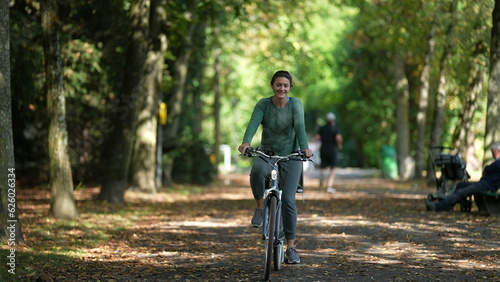 Wallpaper Mural Mother riding bicycle with child in bike back seat outside in nature Torontodigital.ca