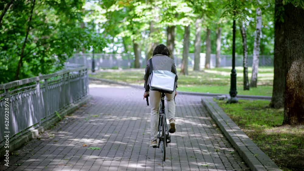 Businessman riding bike in city Businessman riding bike in city