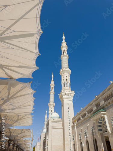 The mosque was founded by Prophet Muhammad. The famous umbrellas and minaret of the Prophet's Mosque. Masjid an-Nabawi.