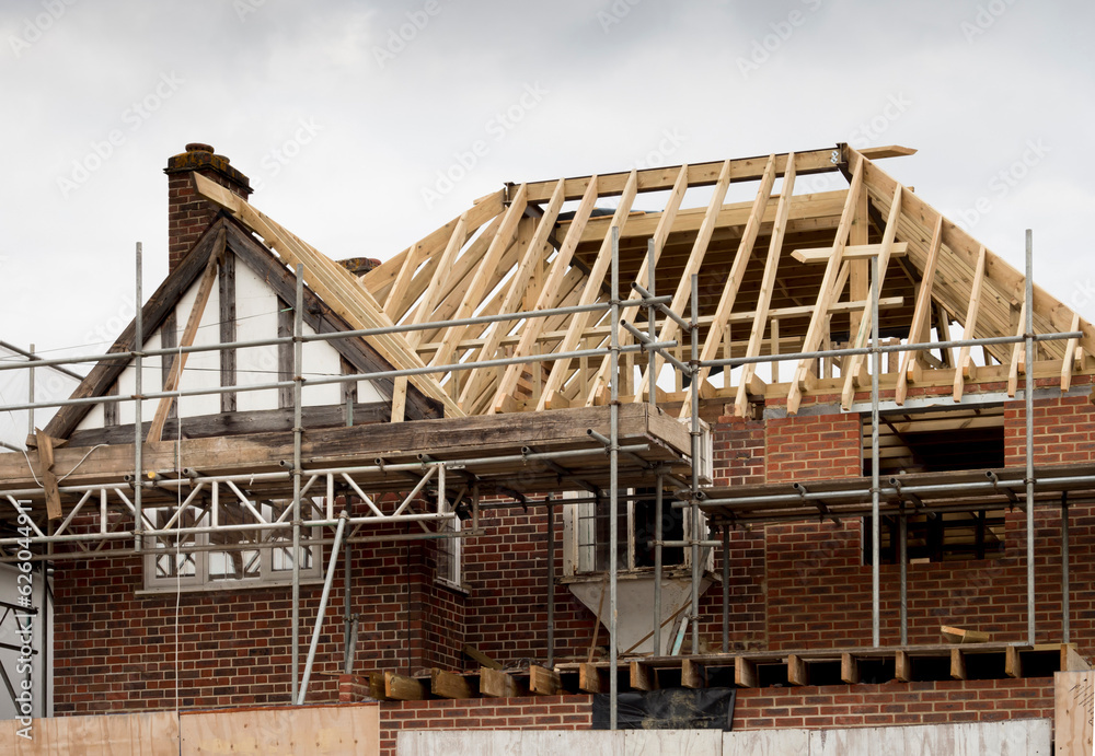 Europe, UK, England, Surrey, scaffolding on house roof renovation