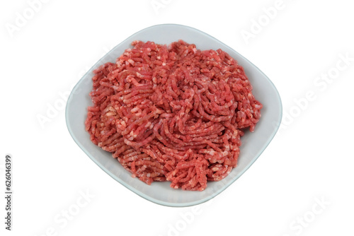 Bowl of mince isolated on white background. Homemade minced meat comes out of the meat grinder. Cooking a burger.