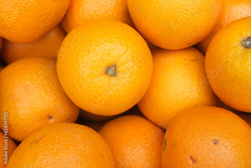 Pile of fresh ripe oranges as background, top view