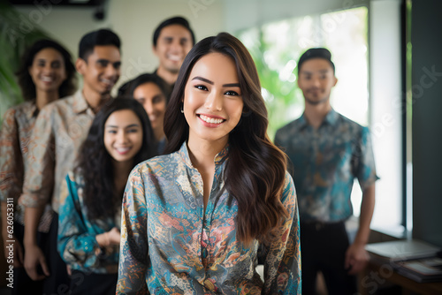 group of business people in office wearing batik