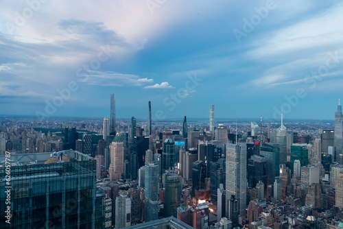 Captivating aerial view of New York City skyline right after the sunset seen from The Edge. The buildings are starting to lit up the lights. Endless rows of buildings. Bustling city. Endless horizon photo