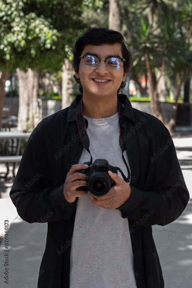 passionate photographer poses with camera passionate photographer poses with camera
