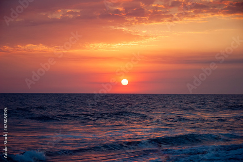 Sunset on a Guatemalan beach called Monterrico  contact with nature under the sunset on a black volcanic beach.