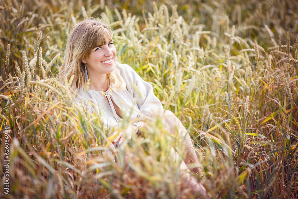 beautiful girl in a linen dress in a wheat field beautiful girl in a linen dress in a wheat field